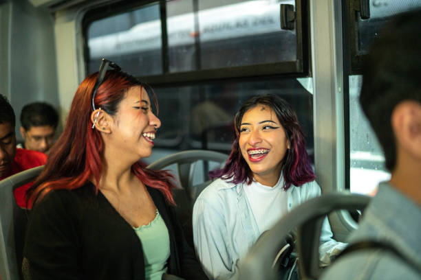 istock Young friends women talking on a bus 1469992325