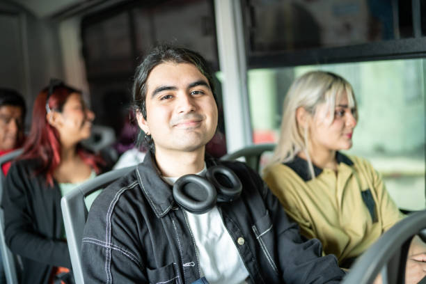 istock Portrait of young man on a bus 1469992330