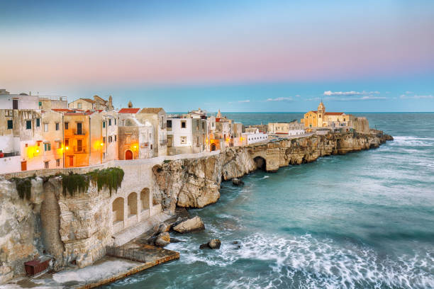 Vieste - beautiful coastal town on the rocks in Puglia Vieste - beautiful coastal town on the rocks in Puglia. The church of San Francesco di Vieste. Gargano peninsula, Apulia, southern Italy, Europe. puglia beach stock pictures, royalty-free photos & images