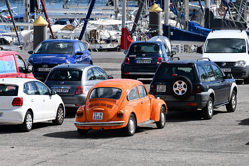 Santa Cruz de Tenerife, Canary Islands, Spain, February 8, 2023 - Orange VW Beetle 1303 S from 1974 on a parking lot in the port of Santa Cruz de Tenerife.
