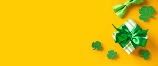 istock Saint Patrick day concept flat lay with green gift box close up on yellow background, 1469995610