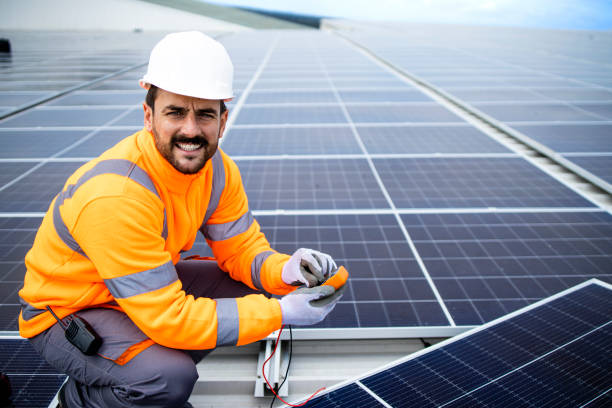 istock Solar company contractor checking functionality of solar photovoltaic panels. 1469997463
