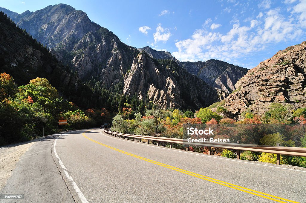 Road Leads to Mountains Highway leads to the Big Cottonwood Canyon, Utah Aspen Tree Stock Photo