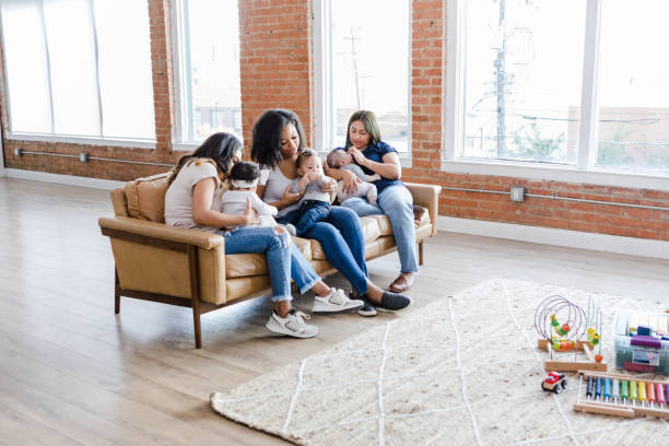 istock While caring for their young children, the young mothers talk 1469999707