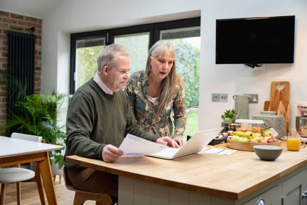 istock Retired Caucasian couple discussing financial plans 1469999948
