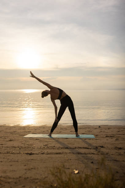 istock Yoga exercise by the sea 1470001178