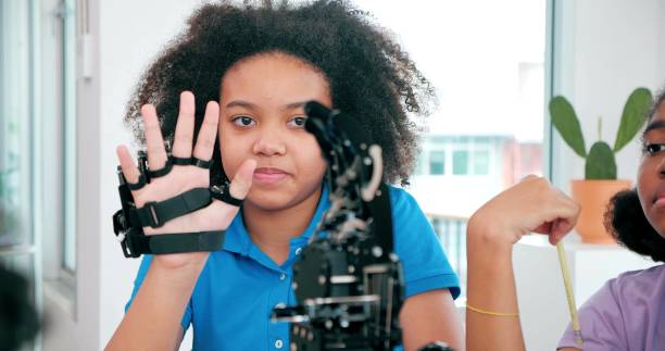 istock African black teenager students learning about robotic arm school, Technology and Innovation concept 1470001274
