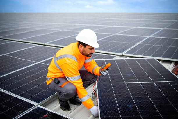 istock Solar company contractor checking functionality of solar photovoltaic panels. 1470001596