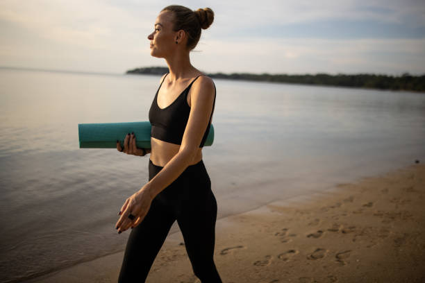 istock Going to do yoga on the beach 1470001610