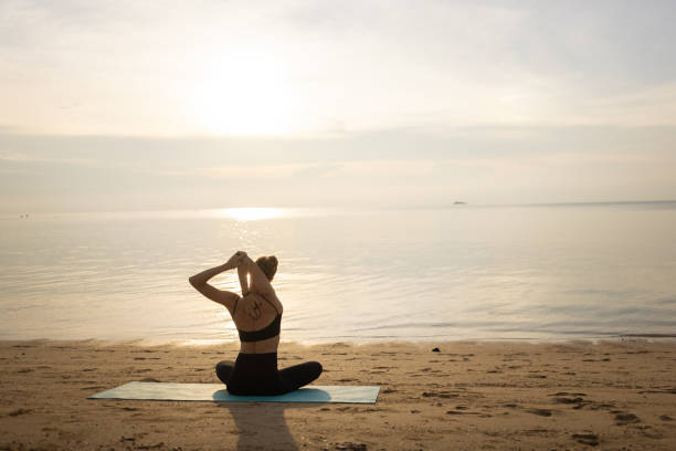istock Woman exercising yoga in sunset 1470001622