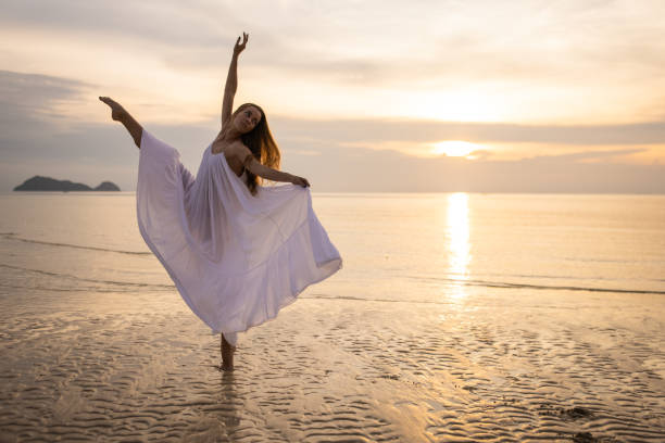 istock Ballerina in white dress dancing 1470001947