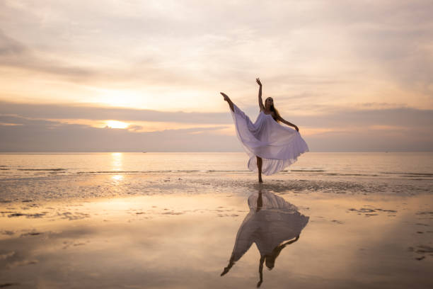 istock Ballerina in white dress dancing 1470002620