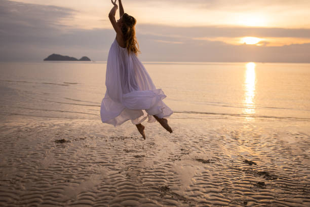 istock Woman dancing in sunset 1470002739