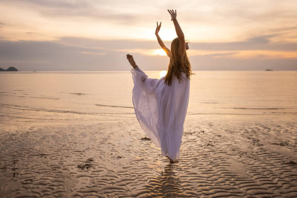 istock Ballerina dancing on the beach 1470002848
