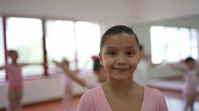 Portrait of girl ballet dancer at the dance studio