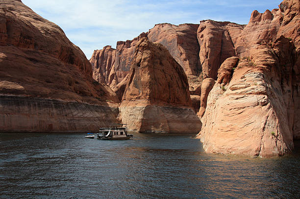 Houseboating Vacation Spend your time in the solitude of the back canyons of Lake Powell. lake powell stock pictures, royalty-free photos & images