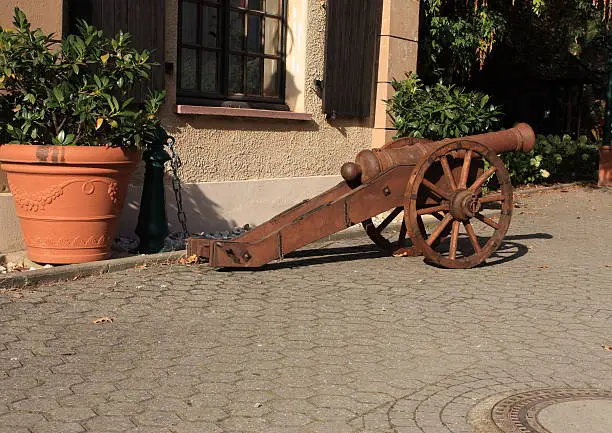 An old and good-looking cannon in front of a castle in germany
