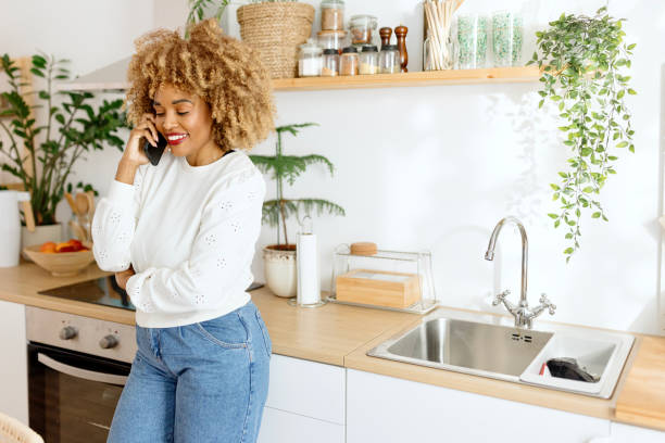 istock Beautiful woman talking on a smartphone 1470007886