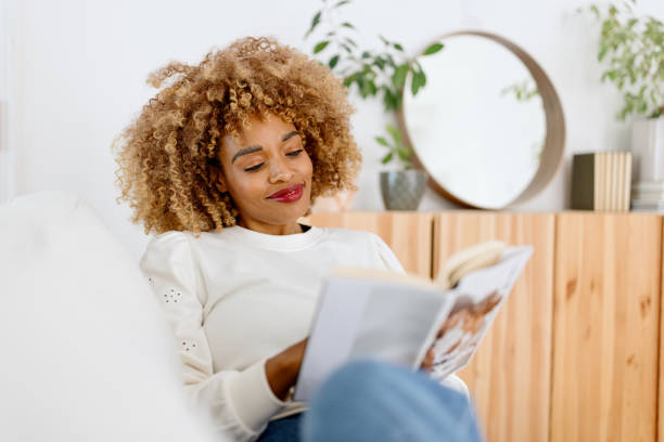 istock Relaxed woman reading a book 1470008017