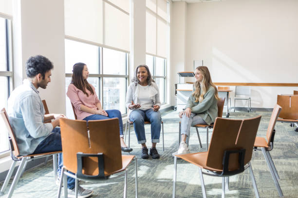 istock Senior woman leads diverse focus group 1470008202