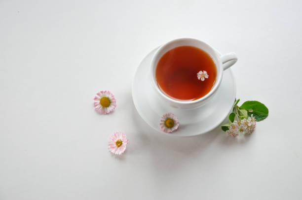 istock cup of tea on a light background with flowers 1470009826
