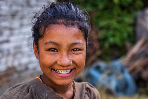 Portrait of happy Nepali girl  in village in Annapurna Conservation Area.