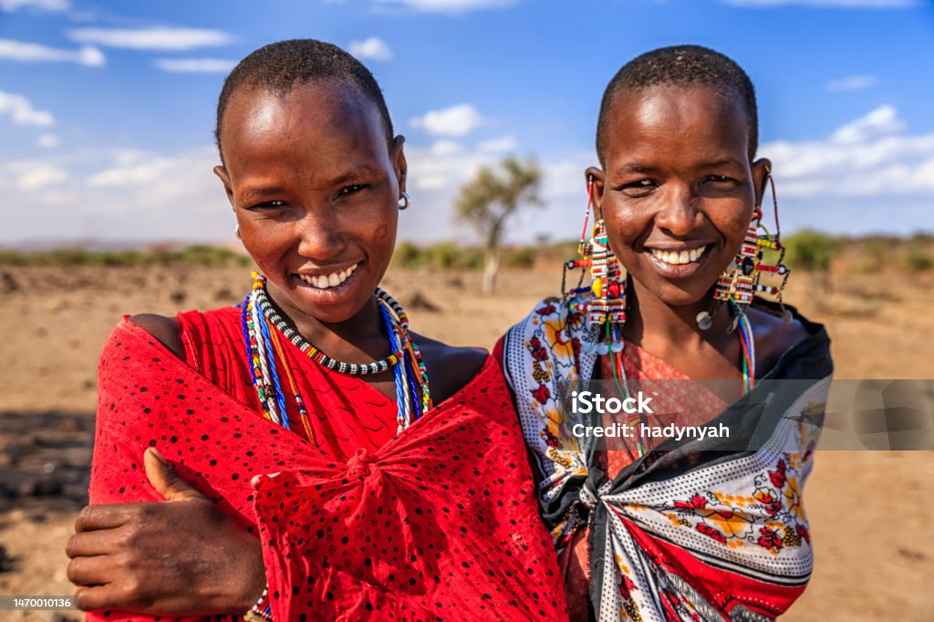 Portrait of African women from Maasai tribe, Kenya, Africa Portrait of African women from Maasai tribe, central Kenya, Africa. Maasai tribe inhabiting southern Kenya and northern Tanzania, and they are related to the Samburu. Amboseli National Park Stock Photo