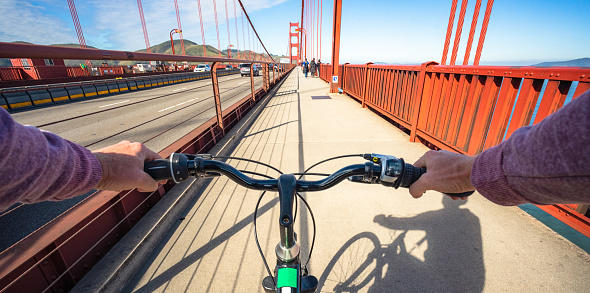 A view from a wearable camera during a cycle trip over the Golden Gate Bridge near San Francisco in California on a bright, sunny day.