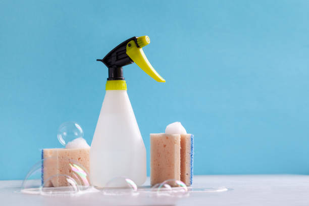 istock Cleaning set for different surfaces in kitchen, bathroom and other rooms on blue background. Cleaning service concept. 1470010683