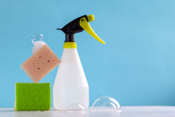 istock Cleaning set for different surfaces in kitchen, bathroom and other rooms on blue background. Cleaning service concept. 1470010687