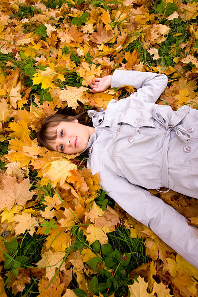 istock Young woman and autumn leaves 147001323