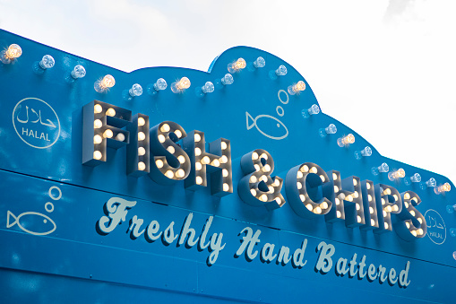 Fish and chips in illuminated letters