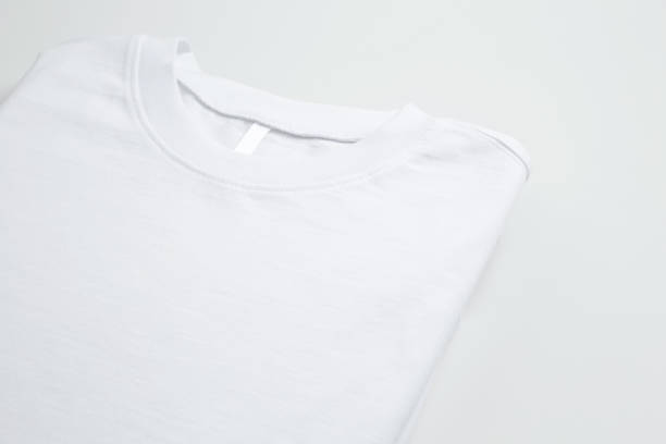 istock Basic folded white t-shirt. Mock up for branding t-shirt. Copy space 1470014141
