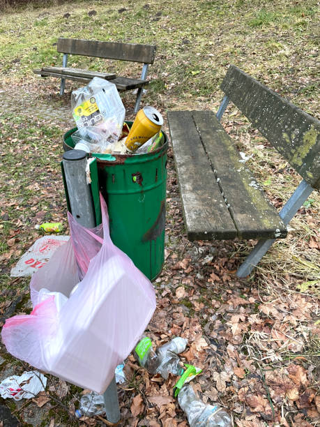 Horní Benešov, Czech Republic - December 29, 2022: Overflowing trash can in the park.