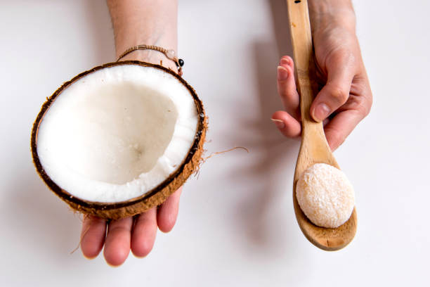 istock Hands holding coconut and coconut sweet (coconut brazilian beijinho) 1470018176