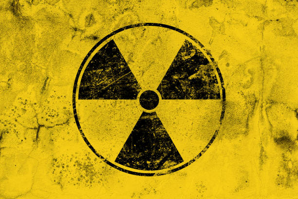istock Black radioactive sign over yellow background 1470019846