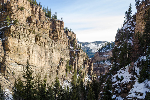 Snowy Steep cliffs of Glenwood Canyon, Colorado, USA.