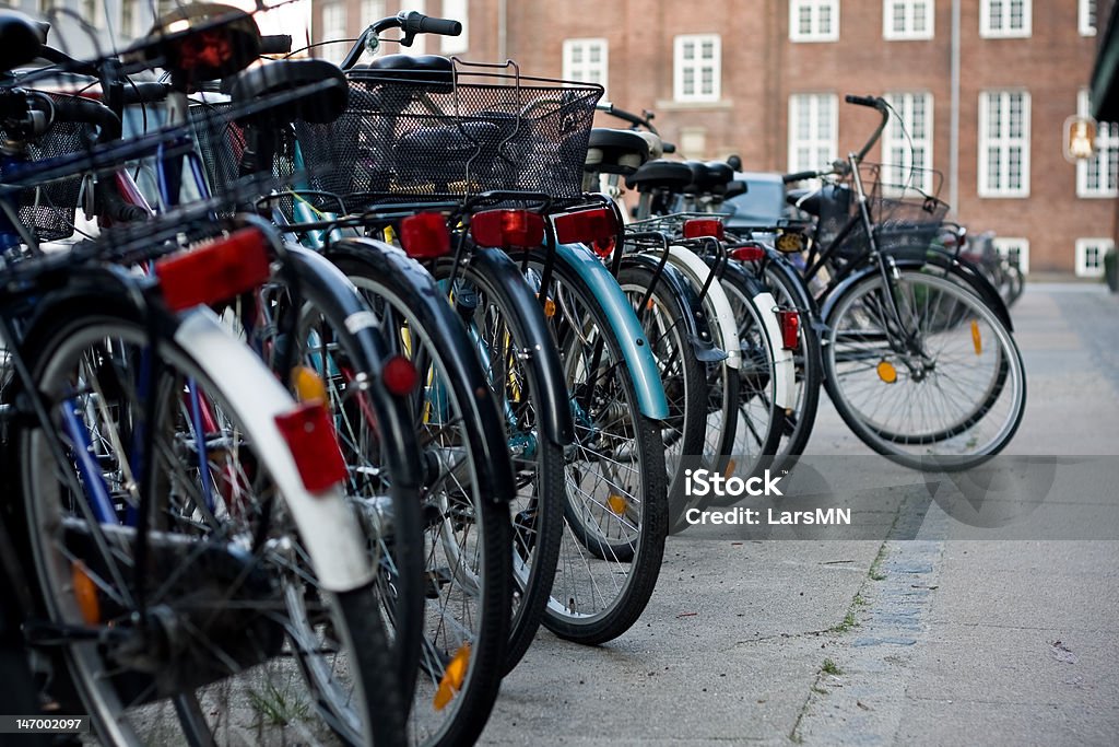 Bicycles A row of bicycles on a quiet street in Copenhagen, Denmark Bicycle Rack Stock Photo