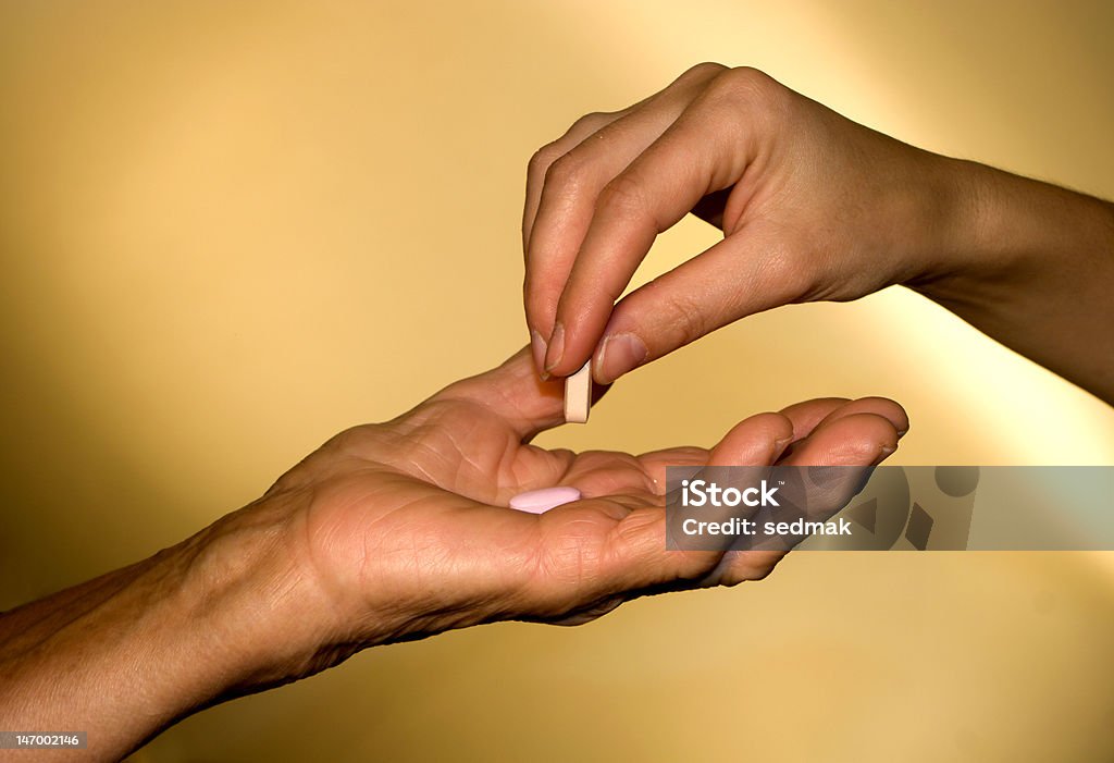 hand of old and young woman with the medicament Adult Stock Photo