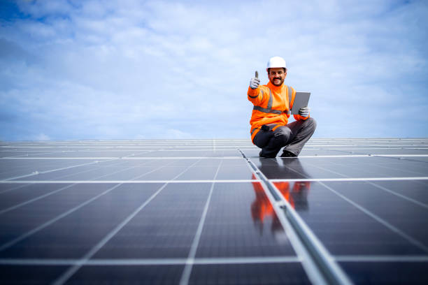 istock Installation of solar panels and professional worker checking quality. 1470021480
