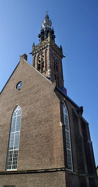 istock Old Dutch Church with tower reaching the sky 147002180