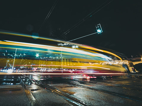 light trails of tram in the city at night