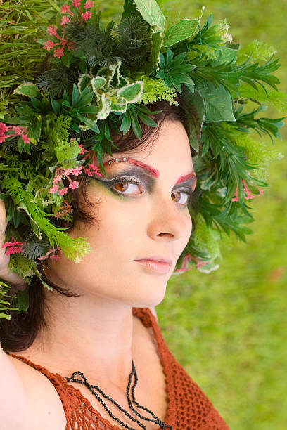 istock woman lie on grass with Wreath 147002426