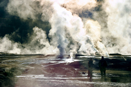 San Pedro de Atacama region, Chile.  May 7th 2006.  Dawn visitors to the steaming volcanic geysers at El Tatio in the Andes Mountains.