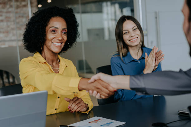 istock Business woman shaking hands 1470025462