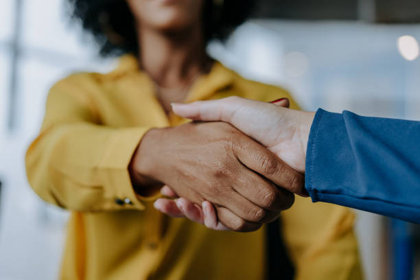 istock Two businesswomen shaking hands 1470025521