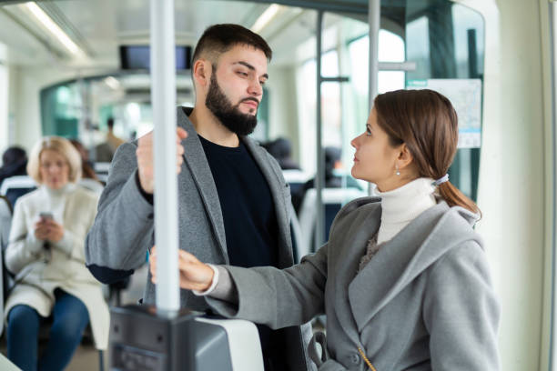 istock Happy passengers flirting in subway and smiling 1470025526