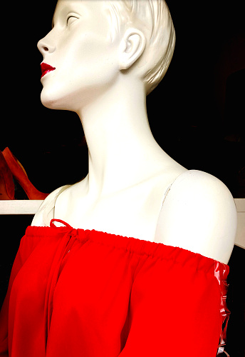 Red female mannequin on a blue background