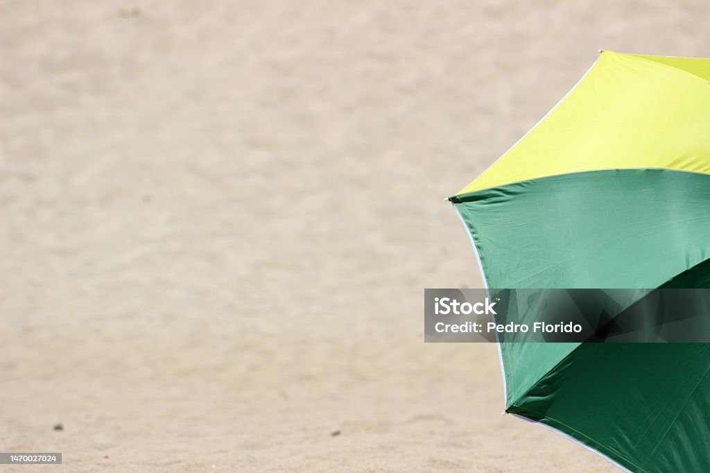 Parasols & Windshields Parasols and colorful windshields are part of the equipment of any Portuguese person who goes to the beach. Beach Stock Photo