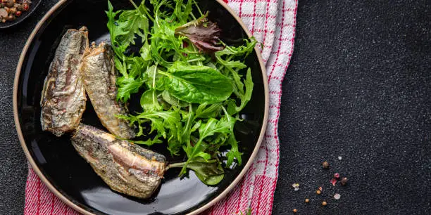 sardine salad freshgreen leaves  seafood snack meal food on the table copy space food